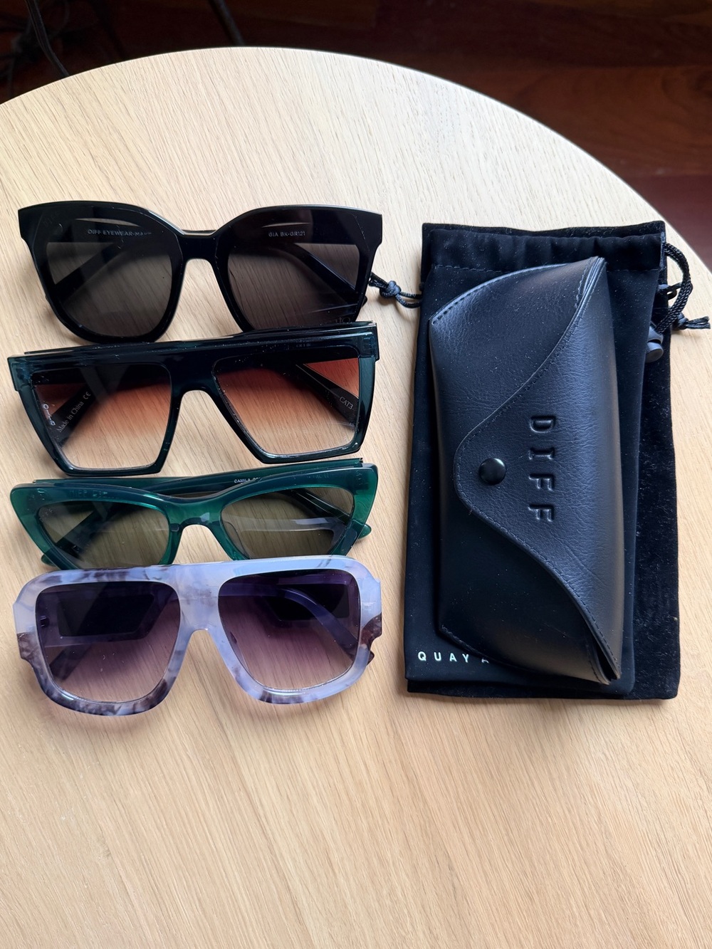 Four pairs of sunglasses - 2 x Diff, 1 x Quay, 1 x unknown